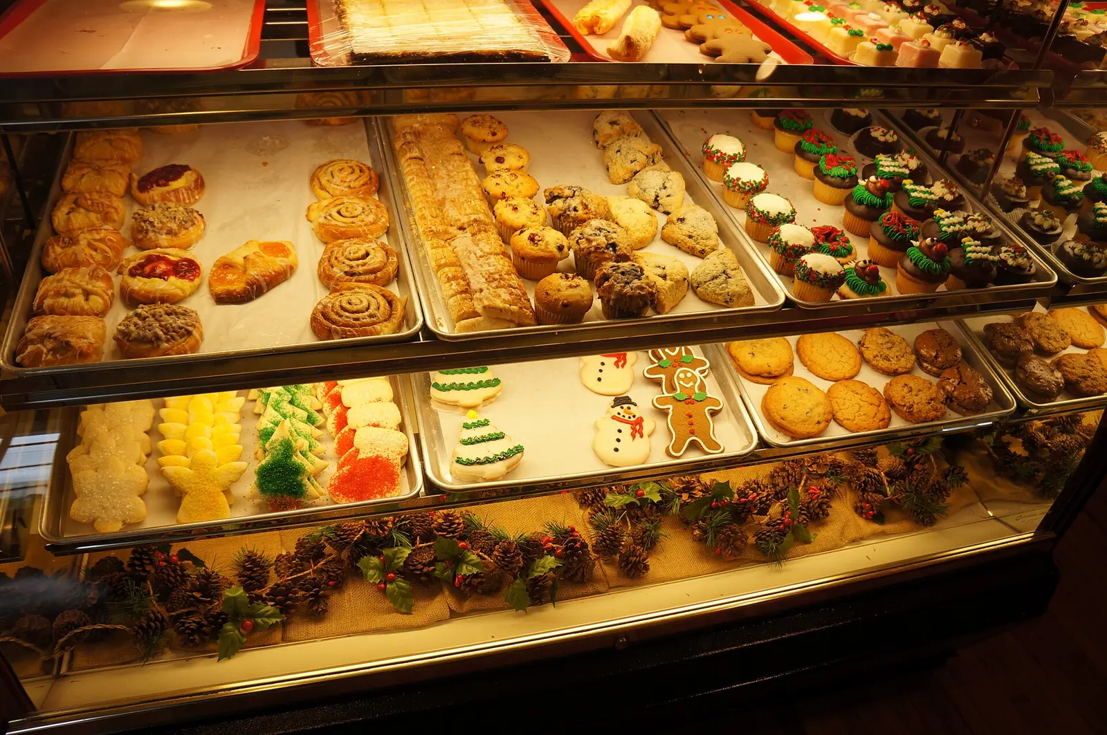 Danishes, cinnamon rolls, muffins, scones, cupcakes and holiday cookies in a display case at a bakery in Greenville, S.C. The photo was not taken in Bluffton.