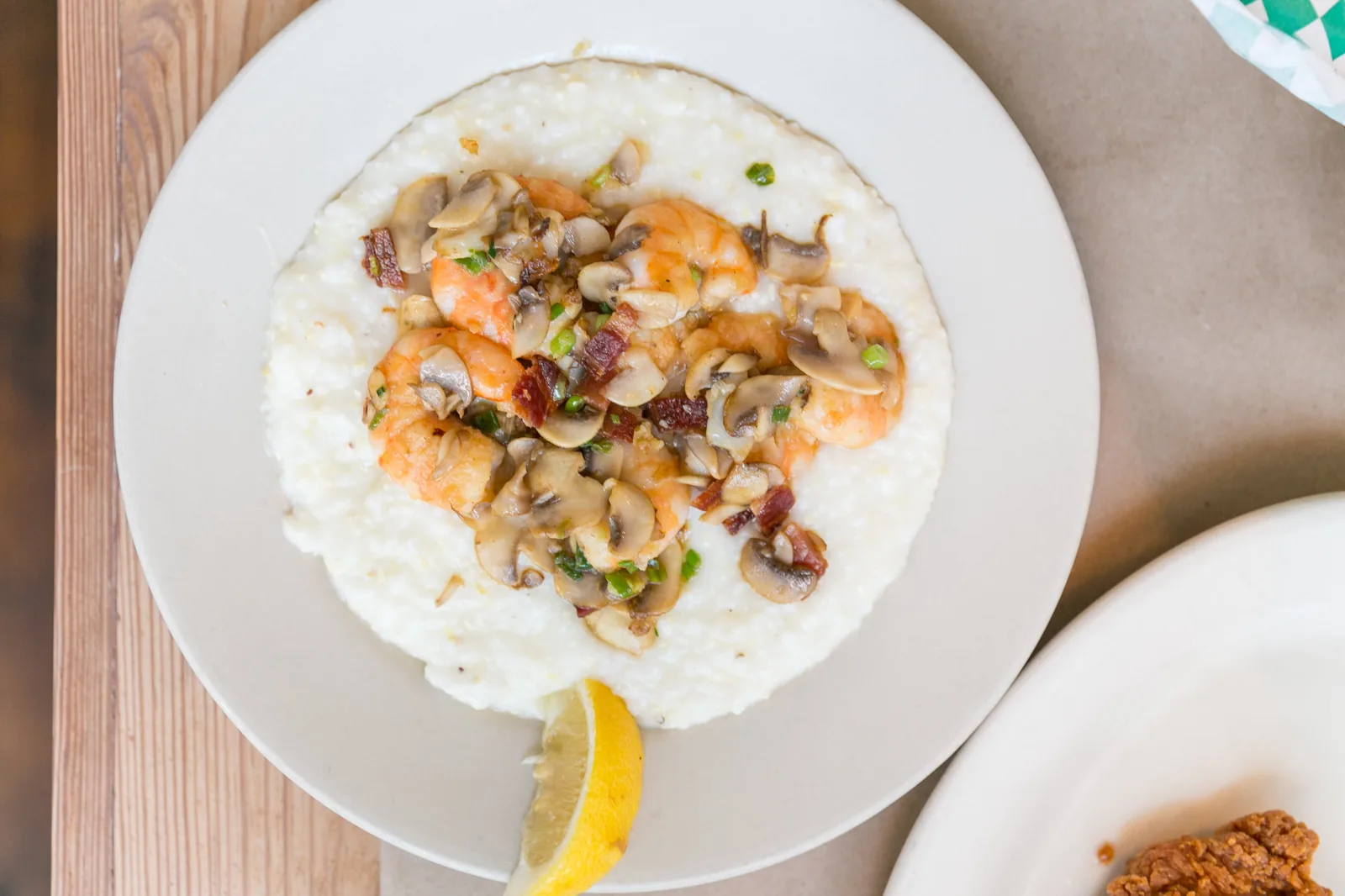Shrimp and grits with mushrooms, scallions and bacon over cheese grits at Hominy Grill in Charleston, S.C.