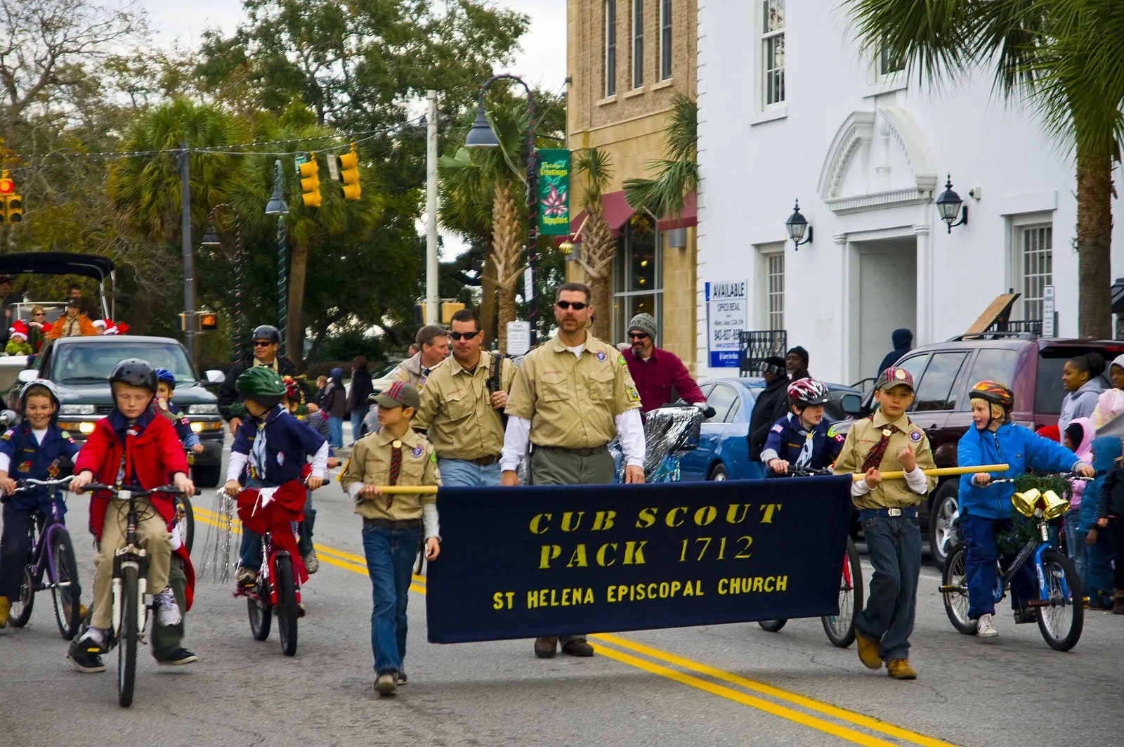 Cub Scout Pack 1712 marches with its banner in the Beaufort Christmas Parade on Bay Street in Beaufort, S.C.