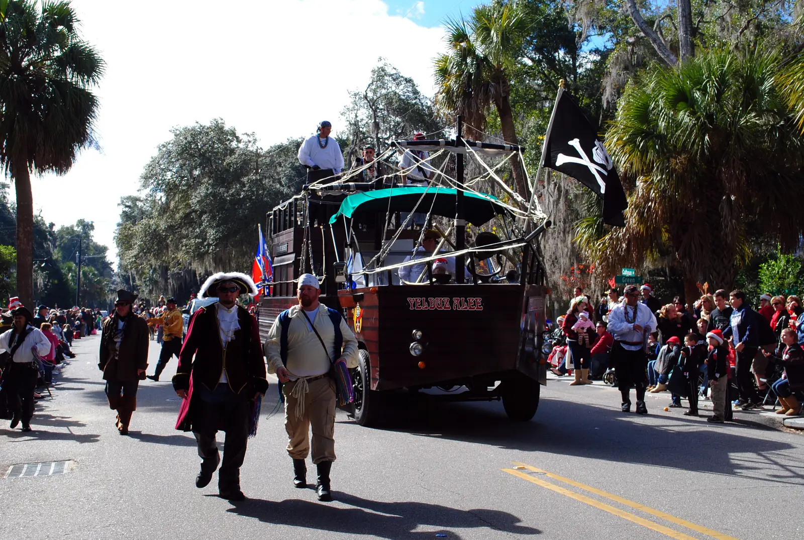 A pirate ship float and costumed pirates roll down the street in the Bluffton Christmas Parade in Old Town Bluffton.