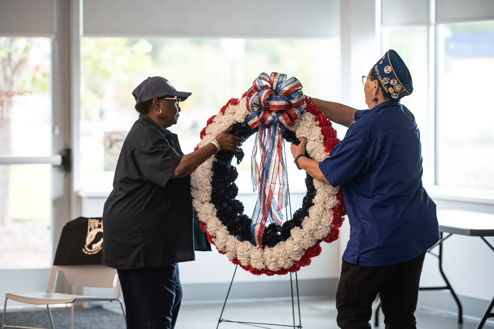 Veterans place a red, white and blue wreath in memory of the fallen during a ceremony in Orangeburg, S.C.