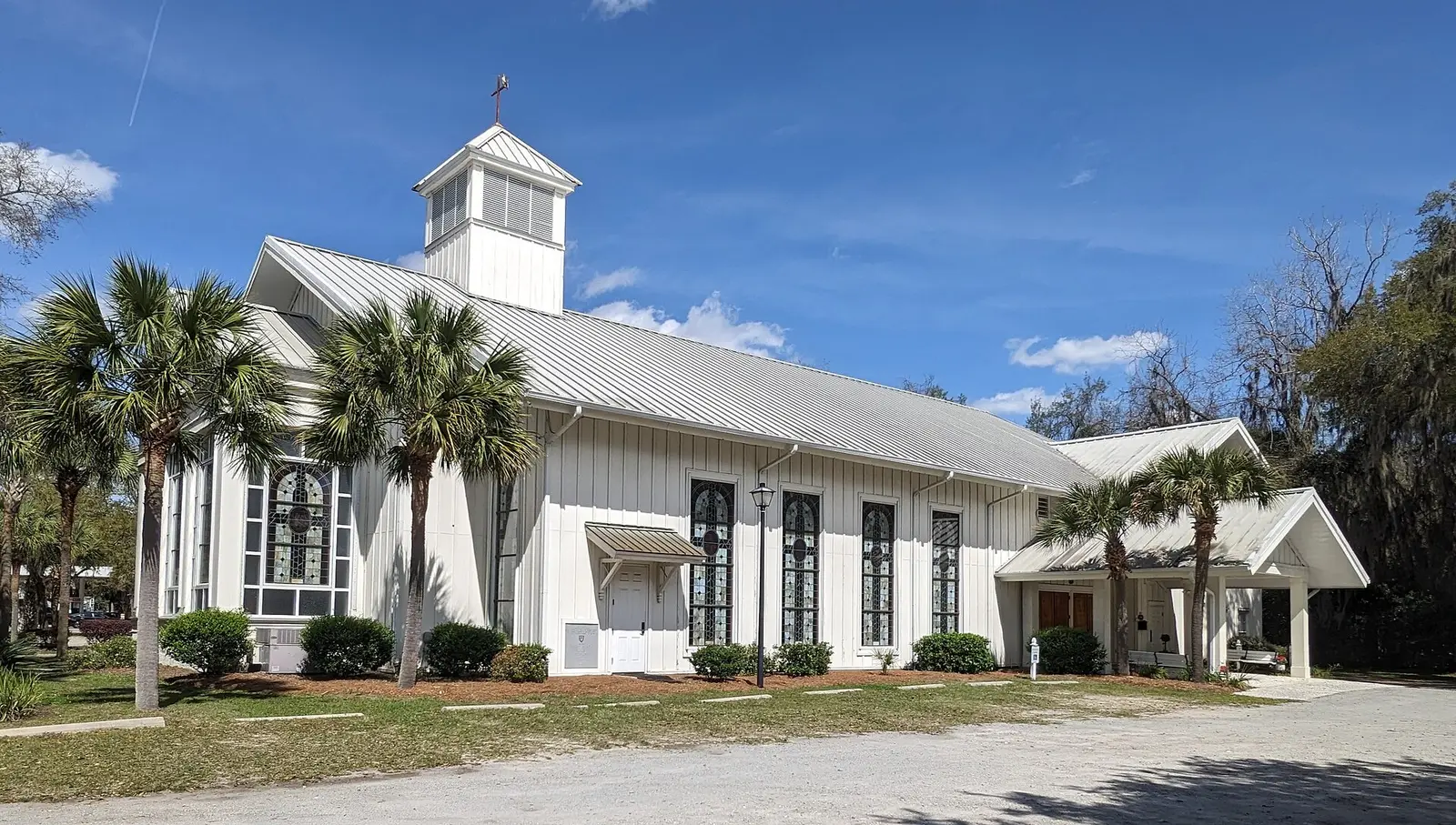 Campbell Chapel AME Church, a white clapboard church with a cupola and stained glass windows, in Bluffton.