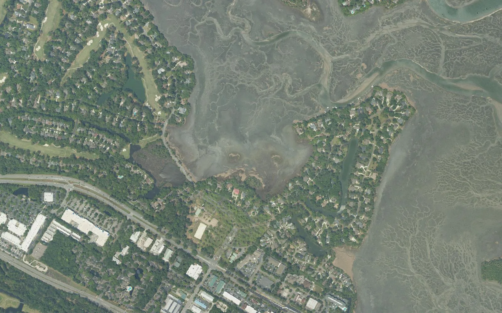 Aerial view of golf course homes, salt marsh and the U.S. 278 corridor in the Moss Creek and Buckingham area of greater Bluffton.