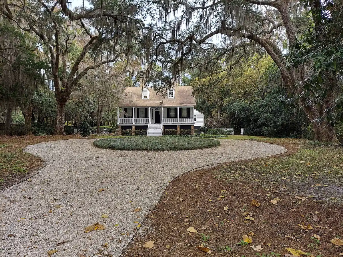 A raised Lowcountry house under live oaks and Spanish moss in Bluffton.